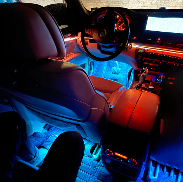 Customizable luxury car ambient lighting kit. Features dual-zone red and blue LED glow for a personalized high-end interior aesthetic in any vehicle.
