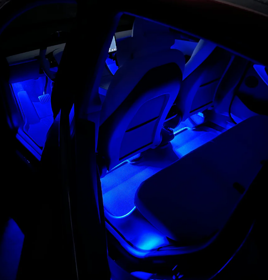 Rear seat LED footwell lights in deep blue. Discreetly installed Anywhere Lights by Add-On® provide uniform ambient glow for back seat passengers.